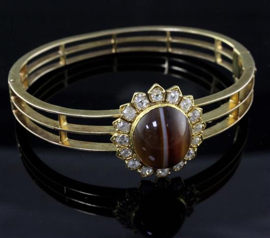 A mid 20th century Victorian style pierced gold, diamond and cabochon banded agate set hinged bracelet.